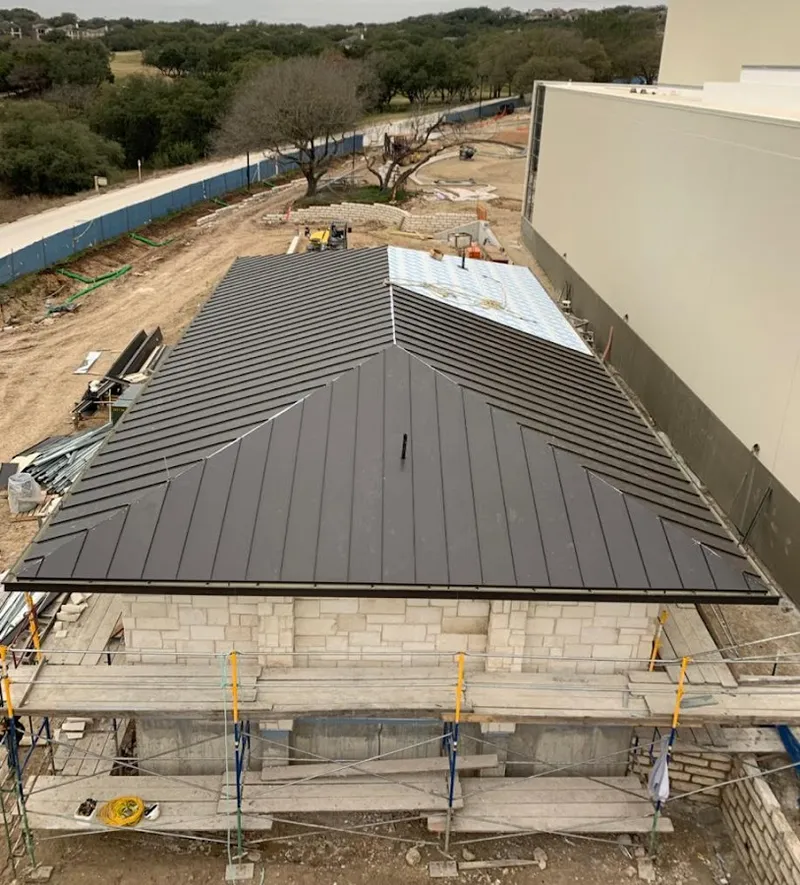 Metal roof new construction with scaffolding in Hamlet